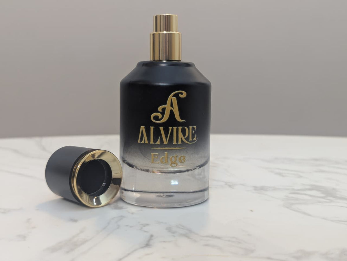 ALVIRE Edge perfume with the cap removed, showing the gold spray