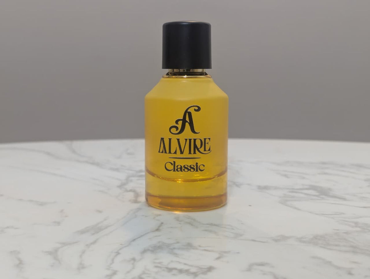 ALVIRE Classic 50 ml perfume bottle in golden glass on a marble table